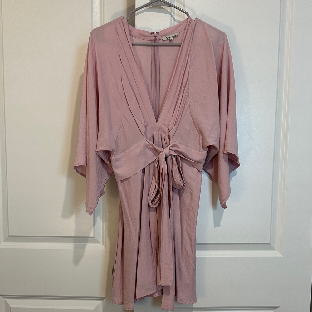 These three pink tie front dress